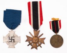 Three German WWII medals.