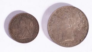 A higher grade 1881 Half Crown with a toned higher grade 1900 Shilling coin.