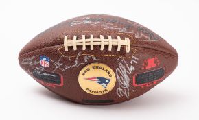 A signed limited edition New England Patriots Superbowl XXXVI American football.