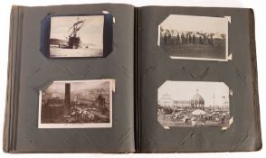 A collection of early 20th Century and later postcards in two albums.