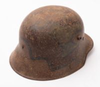 A WWI period German M1914 patter stahlhelm, painted in green, brown and black and stamped '1.