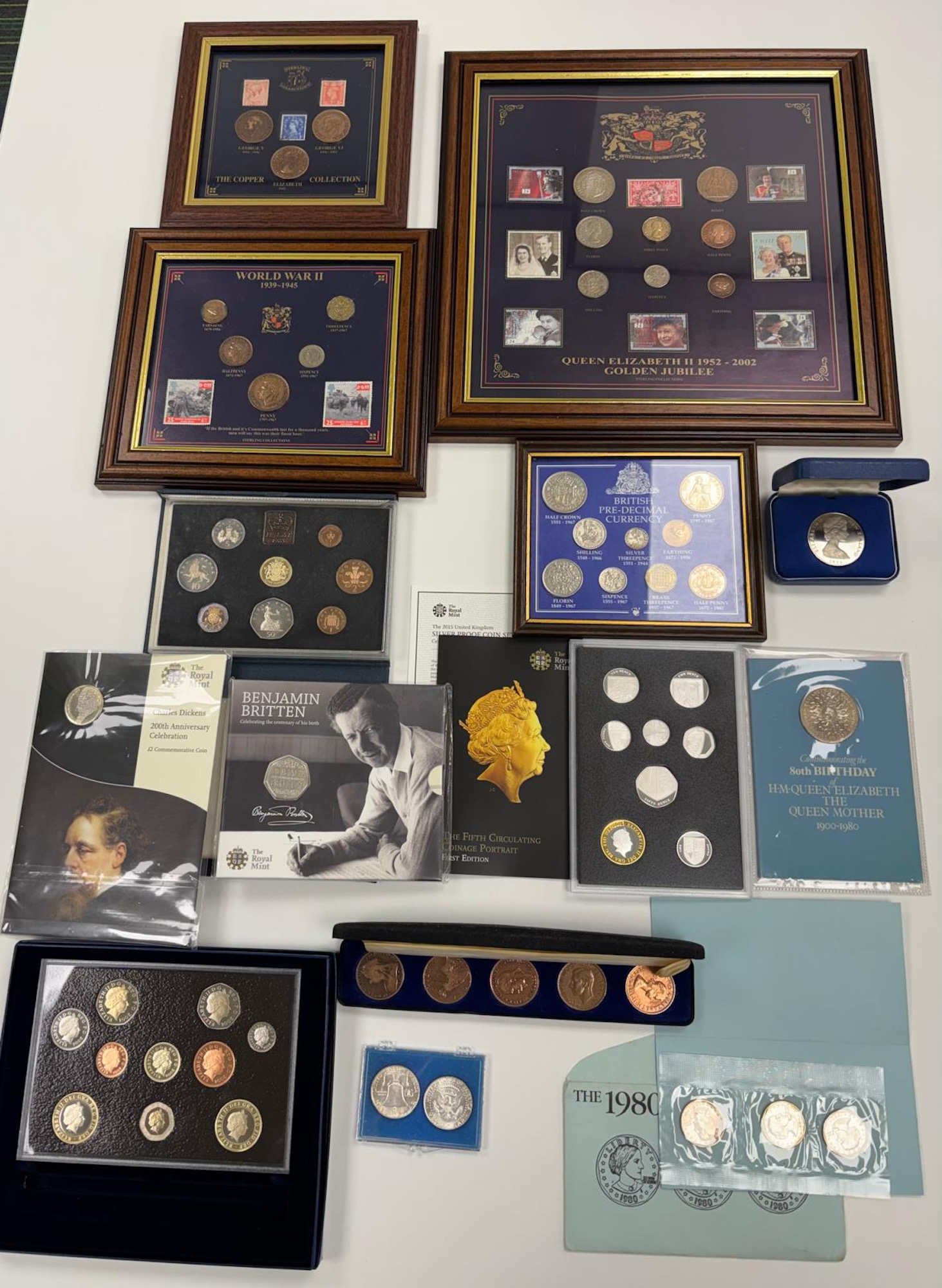 A collection of coins in sets, frames, including silver proofs ...