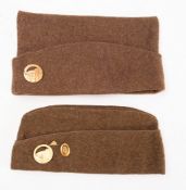 Two French WWII era cloth caps. Both with Maginot Line badges.