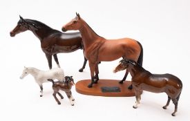 Five Beswick porcelain horses, including Red Rum, in a range of sizes.