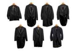 A group of six gentleman's black tailcoats and a black evening jacket,
