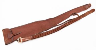 An early 20th Century hand sewn leather 12 gauge cartridge belt together with a canvas slip.