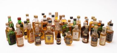 A large collection of whisky miniatures. Including Burberrys, Dewars, Port Dhubh.