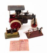 A German model live steam road roller, together with a steam driven water pump,