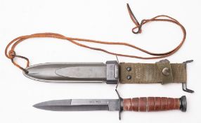 A 20th Century USA M3 bayonet in a USA M8A1 scabbard.