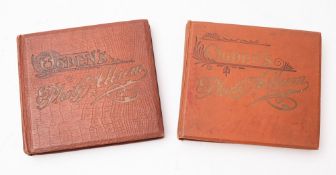 A collection of Ogdens cigarette cards in Ogdens photograph albums.