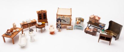 A collection of 20th Century wooden dolls house furniture.