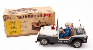 A TN, Japan tin plate Turn-O-Matic gun jeep.