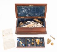 An early 20th Century military badges and buttons.