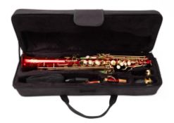 An Ammoon Soprano Saxophone, in red with gold trim and in fitted case.