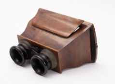 A 19th century walnut Brewster pattern stereoscopic viewer: with ebony mounted eyepieces and
