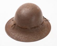A WWII Zuckerman steel helmet. With stamps to the rim and leather sweatband.