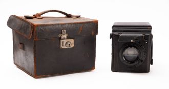 A Houghton-Butcher 'Popular Pressman' quarter plate camera, fitted F3.