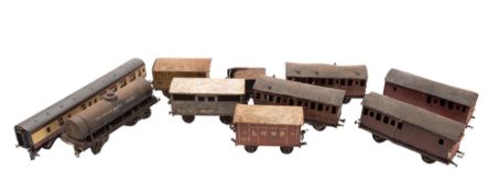A collection of tin plate gauge 1 passenger coaches and wagons.