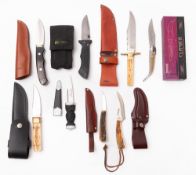 A group of various hunting knives, including a Bowie style knife by Copper,