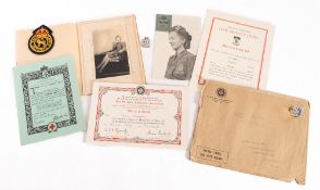 A WWII cloth Civil Defence Corps badge. Together with ephemera including Red Cross certificates etc.