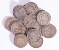 A collection of twenty Victorian shilling coins.