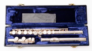 A Signet Special silver plated flute. Serial number 041055, in a fitted case.