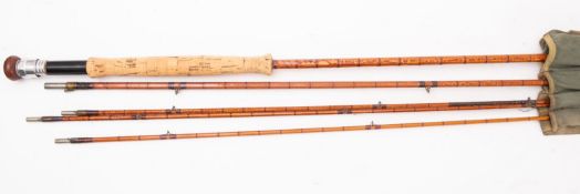 A Hardy Bros, Alnwick 'Gold Medal' three piece fly fishing rod. With spare tip and in cloth bag.