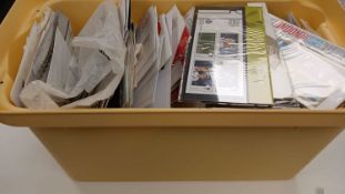 Plastic tub with large quantity of GB new issue stamps in presentation pack inserts,