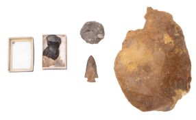 A flint axe head. Together with three ar