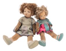 Two early 20th Century linen head dolls.