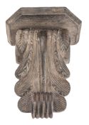 A carved and stained oak wall bracket, 2