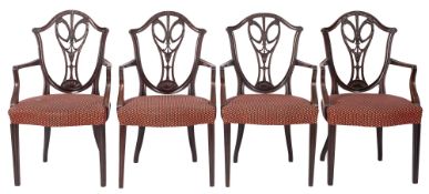 A set of four mahogany and upholstered e