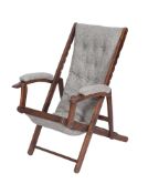 A stained hardwood and upholstered foldi