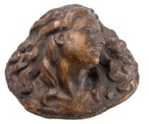 A painted plaster relief of the head of