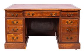 A walnut pedestal desk in George III sty