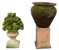 A terracotta urn with associated composi