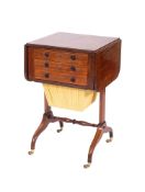 A Regency mahogany and inlaid drop-flap writing and work table, bordered with sycamore lines,