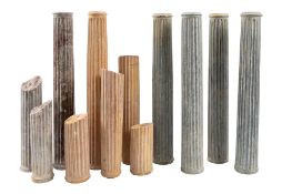 A group of nine marble columns, early 20th century; comprising three in marmo giallo, two in red,