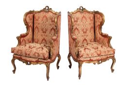 A pair of French carved giltwood bergere armchairs,