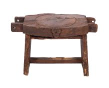 An 18th century oak cheese press, adapted as a rustic occasional table,