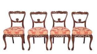 A set of four Indo Colonial carved rosewood dining chairs,