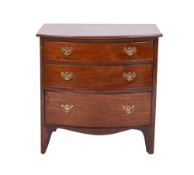 A mahogany bowfronted chest of small size, adapted from a commode,