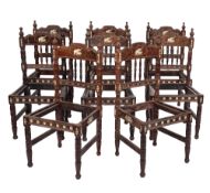 A set of eight Anglo Indian rosewood and ivory inlaid dining chairs,