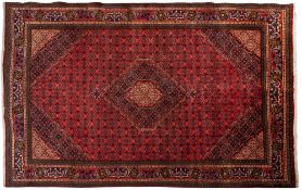 A Bidjar carpet, the rose field with a central indigo shaped lozenge pole medallion,