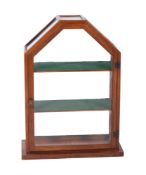 A beechwood and glazed table top display cabinet, of canted arched form,