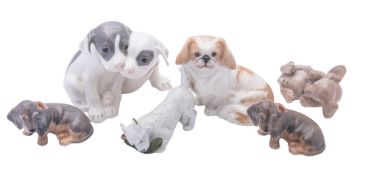 Six Royal Copenhagen porcelain dogs comprising Pointer Puppies after an original by Erik Nielsen,