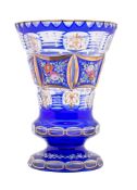 A Bohemian blue overlay glass vase, early 20th century of thistle form,