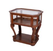 An oak and glazed octagonal bijouterie display table with a hinged fall to either side,