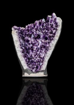 A substantial and impressive rock crystal (amethyst quartz) half geode,
