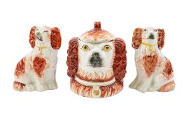 A Staffordshire pottery double face spaniel tobacco jar and cover,